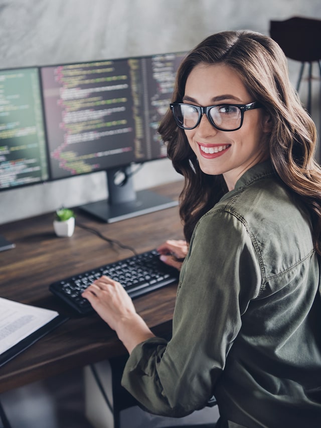 Female software engineer at a desk in an open workspace, representing Google Hyderabad job opportunities in Feb 2025