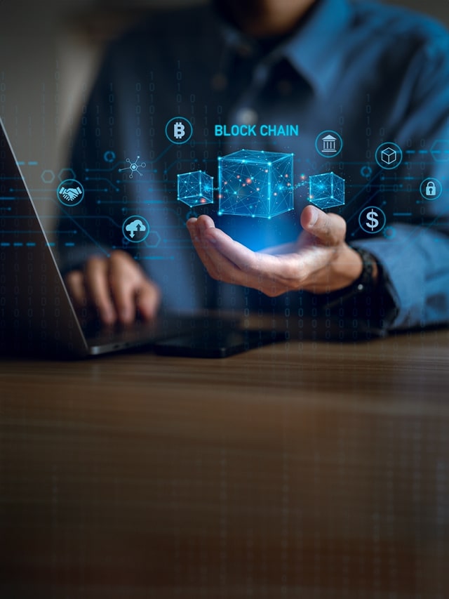 Blockchain technology concept, Businessman hand holding blockchain icon on virtual screen; concept of blockchain developers hiring, jobs