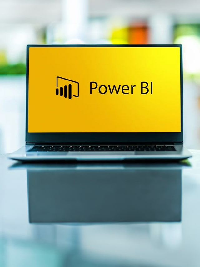 Laptop computer displaying logo of Power BI, career launch as a power bi. Concept power bi developer, jobs