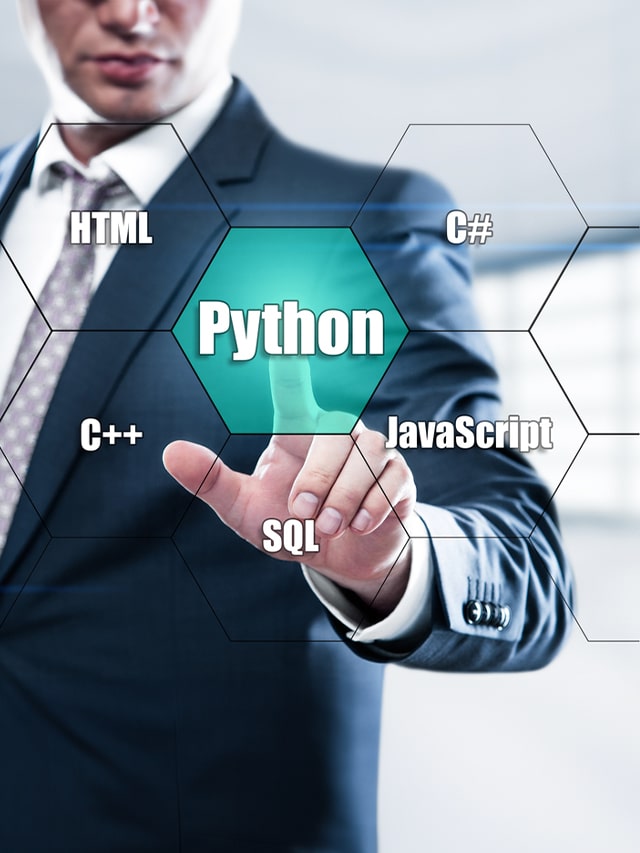 man wearing black suit pointing finger at virtual technologies at Python; concept of Python Developers jobs august 2024