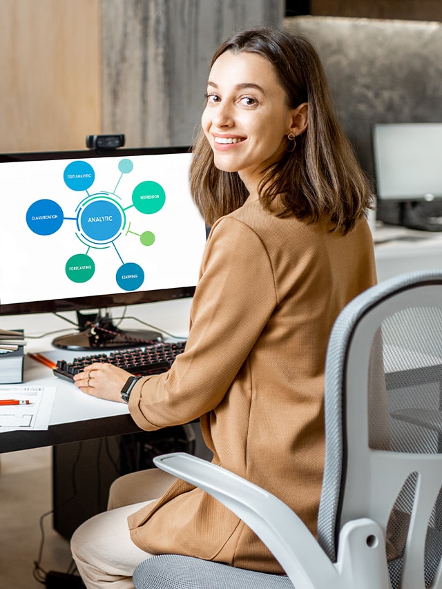Portrait of a young office employee working with some charts and statistics on the computers in the modern office; concept of Top Companies Hiring Data Analyst in Late July 2024