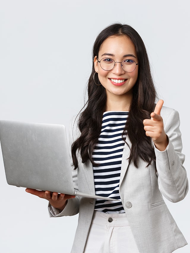Smiling pleased employer praise jobseeker guiding 8 things not to say in an interview, pointing finger camera satisfied, hold laptop