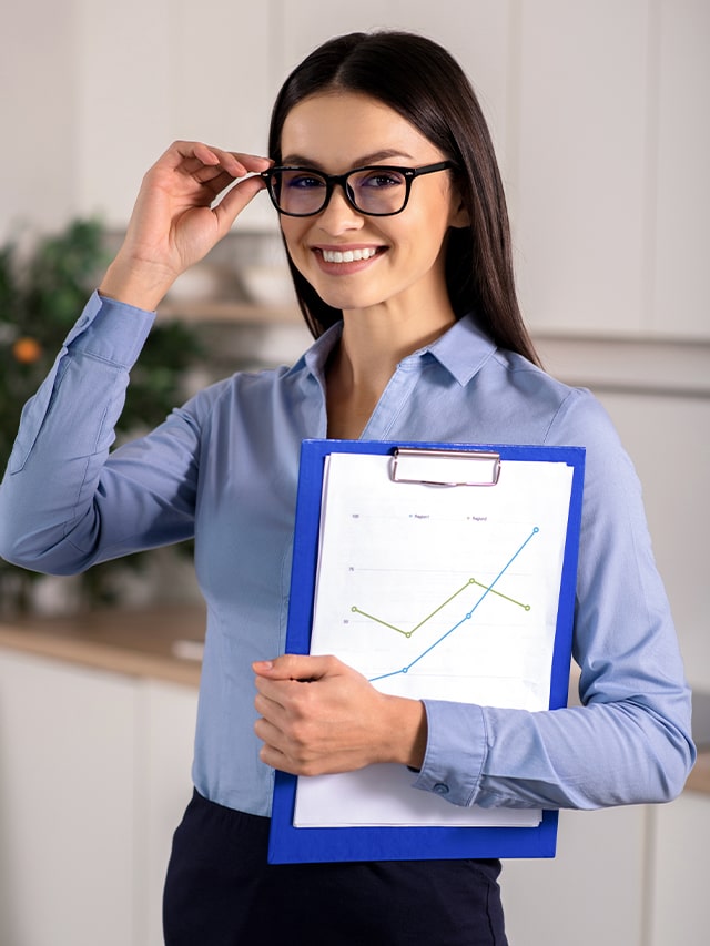 beautiful businesswoman in formal dress holding her folder while wearing glasses; concept of Most Asked Terraform Interview Questions